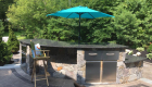 38-Complete backyard renovation with kitchen, waterfall, gas firepit, planting, landscape lighting, drainage and stairs. All walls and steps capped with custom cut bluestone (13)