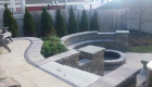 55-Unilock Umbriano pavers with Estate wall. Granite steps, under cap lighting, planting and firepit (7)